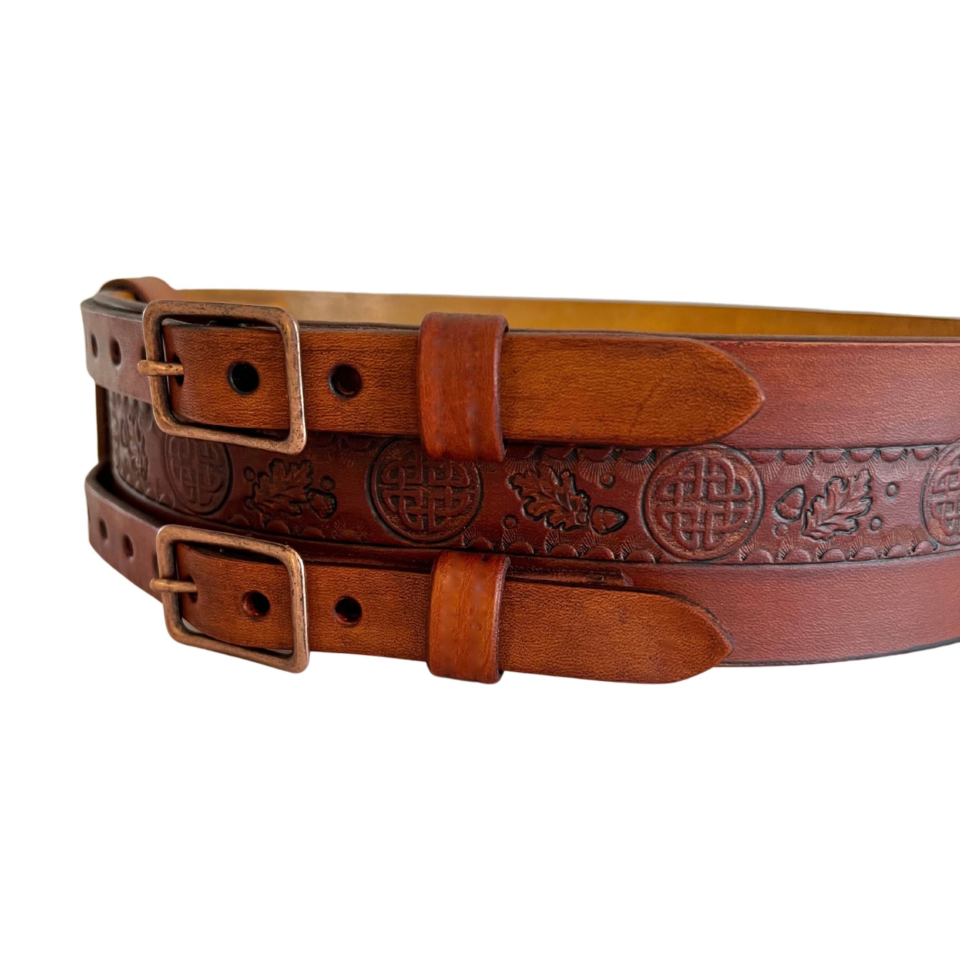Right front view of brown leather double buckle belt with Celtic knot, detail